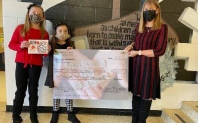 Boo Squad Fund Presents Check to the American Heart Association