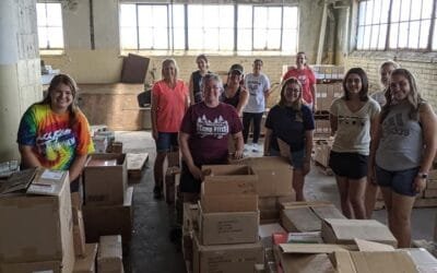 Volunteers Sort 10 Pallets of Donated School Supplies for Distribution