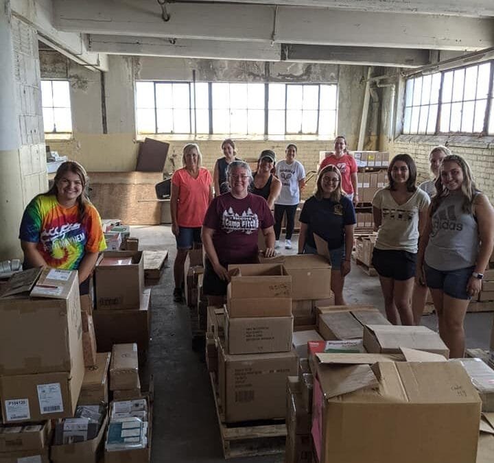 Volunteers Sort 10 Pallets of Donated School Supplies for Distribution